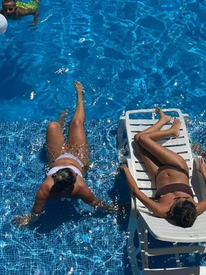 a group of people laying in a swimming pool at Apartman NIKA Vrnjačka Banja in Vrnjačka Banja