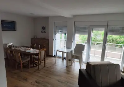 a kitchen and dining room with a table and chairs at Suncani Breg in Soko Banja