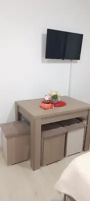a table with a television on top of it at Studio Marija 21 in Soko Banja