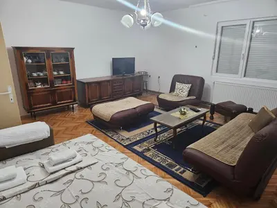 a living room with a couch and chairs and a table at Apartmani,,Drljaca,,1 in Soko Banja