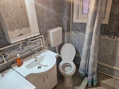 a bathroom with a toilet and a sink at Apartmani,,Drljaca,,1 in Soko Banja