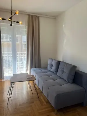 a living room with a couch and a table at Apartman Anja in Vrnjačka Banja