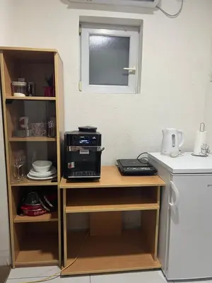 a kitchen table with a printer on top of it at Apartman Soni Jagodina- free jacuzzi, private parking, pet friendly in Kolonije