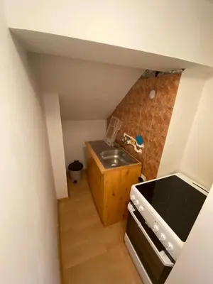 a small kitchen with a sink and a stove at Aparmani,,Drljaca,,3 in Soko Banja