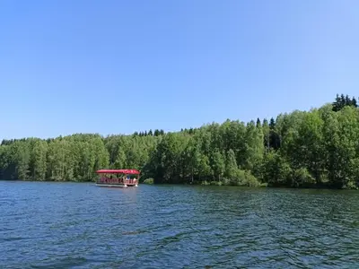 a boat in the middle of a lake at Vlasinsko jezero vila BiLiV in Surdulica