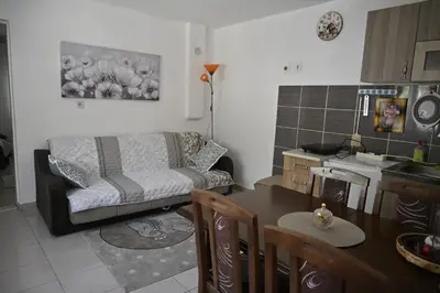 a living room with a couch and a table at Mokino bunarče in Knjazevac.