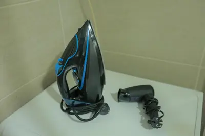 a black and blue umbrella sitting on top of a toilet at Apartman Icić in Pirot