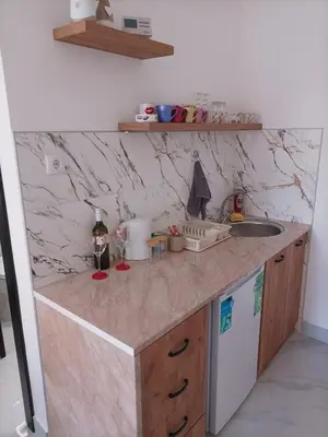 a kitchen with a counter top and a sink at Night-DUBLE MM 2 in Leskovac