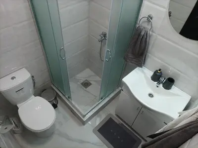a bathroom with a shower and a toilet and a sink at Night-DUBLE MM 2 in Leskovac
