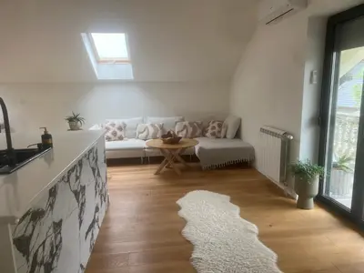 a living room with a couch and a table at Villa Sienna in Vrnjačka Banja