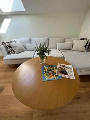 a living room with a coffee table and a couch at Villa Sienna in Vrnjačka Banja
