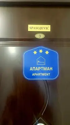 a sign on the door of an airport apartment at Spasojević Apartman in Kuršumlija