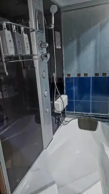a bathroom with a shower and a tub and a toilet at Spasojević Apartman in Kuršumlija
