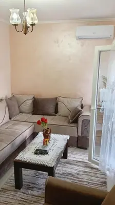 a living room with a couch and a coffee table at Lina apartment in Lebane