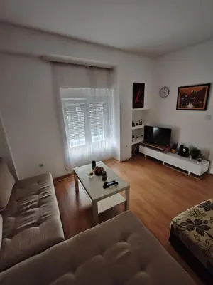 a living room with a couch and a coffee table at Happy house in Kruševac