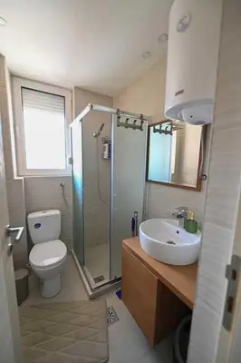 a bathroom with a toilet and a shower and a sink at Zlatnik Vrnjačka Banja in Vrnjačka Banja