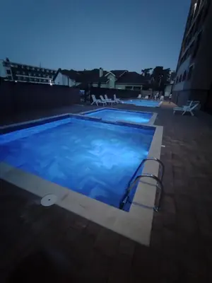 a large swimming pool on top of a building at Apartman NEMANJA in Vrnjačka Banja