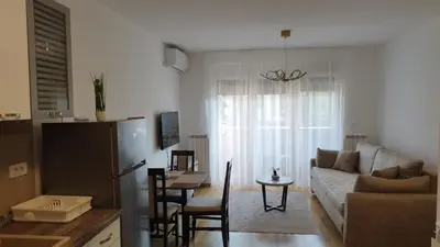 a living room with a couch and a table at Apartman NEMANJA in Vrnjačka Banja