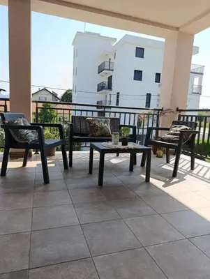 a patio with chairs and a table on a balcony at Villa Nina in Vrnjci