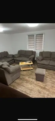 a living room with a couch and a coffee table at Krupajska bajka in Krepoljin