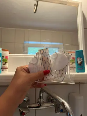 a person is holding a toothbrush in front of a sink at Krupajska bajka in Krepoljin