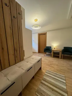 a living room with a couch and two chairs at Kraljica apartman in Vrnjačka Banja