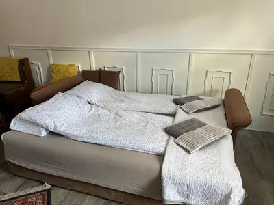 a bed with two blankets on top of it at Miljaca in Pirot