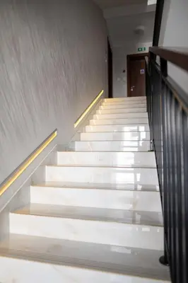 a staircase with white steps in a building at Viktor i Kasija green hill in Soko Banja