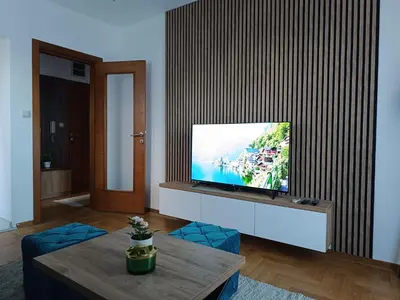 a living room with a flat screen tv at Apartman Savić Solaris in Vrnjci