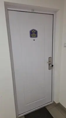 a white door with a sign on it at Dream Rental Pirot Apartman in Pirot
