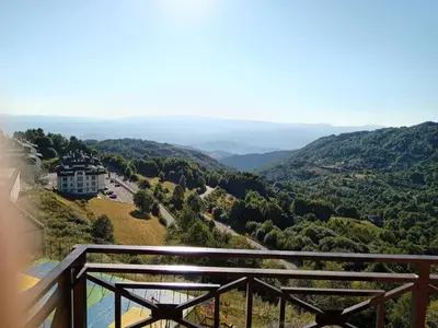 a view from the balcony of a mansion in the mountains at Emili N90a in Cajetina