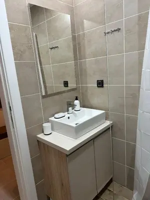 a bathroom with a sink and a mirror at Emili N90a in Cajetina