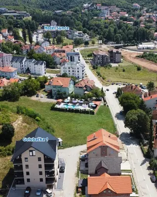 an aerial view of a small town with buildings at Apartman Iznad Sunca in Soko Banja