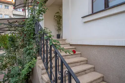 a set of stairs with a red rose on it at Family House in Leskovac