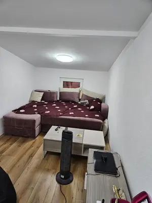 a bedroom with a large bed and a table at Oki in Gornje Stopanje