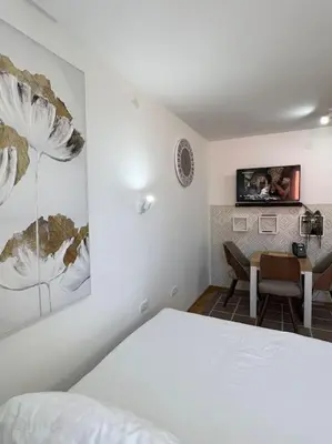 a bedroom with a bed and a desk and a table at Ema - Jakov Kopaonik Kraljevi Čardaci in Kopaonik