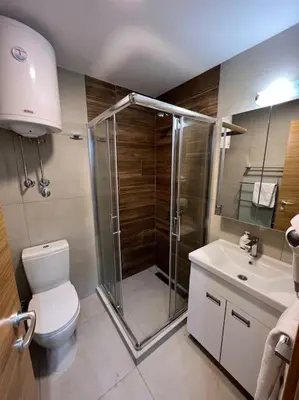 a bathroom with a shower and a toilet and a sink at Ema - Jakov Kopaonik Kraljevi Čardaci in Kopaonik