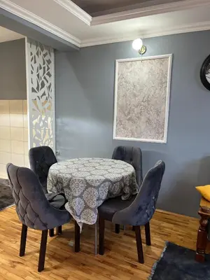 a dining room with a table and chairs at Royal suite Nis in Niš