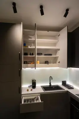 a white kitchen with a sink and a counter at Apartman Grey LUX in Pirot
