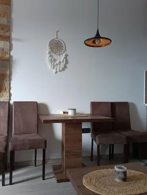 a dining room with a table and two chairs at Milmari resort N12 in Kopaonik