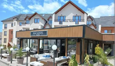a building with a sign for a hotel at Milmari resort N12 in Kopaonik