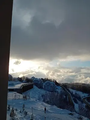 a person standing on a ski slope in the snow at Milmari resort N12 in Kopaonik