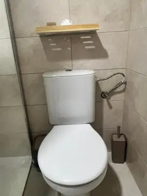 a bathroom with a white toilet in a stall at Apartman Kraljice Natalije in Vrnjačka Banja
