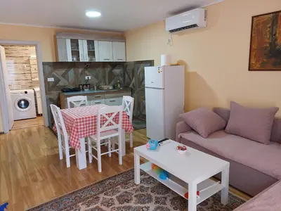 a living room with a couch and a table at Dukat in Soko Banja