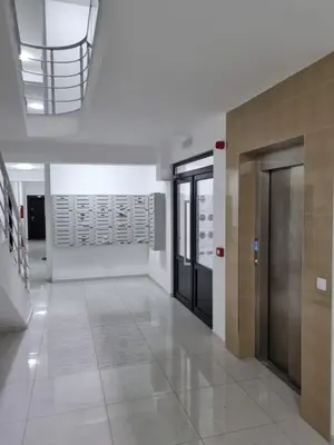 a hallway with doors and a staircase in a building at Marlux 2 in Pirot