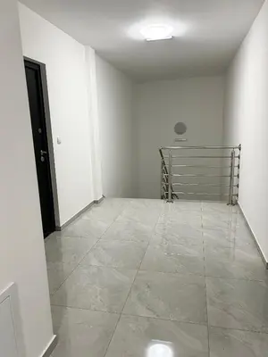 a room with white walls and a tile floor at Millie's apartments in Ćuprija