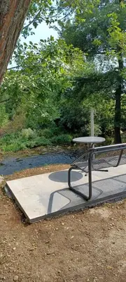 a picnic table sitting on top of a sidewalk at Vikendica Sofia in Žagubica