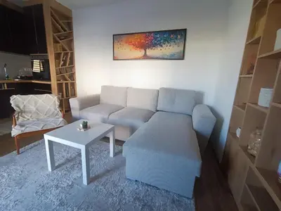 a living room with a couch and a table at Apartmani Krunet in Kruševac