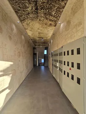 an empty hallway in an office building with graffiti on the walls at Apartmani Krunet in Kruševac