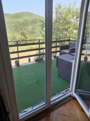 a view from a window of a patio with a table at Vila Tea Borsko Jezero in Bor